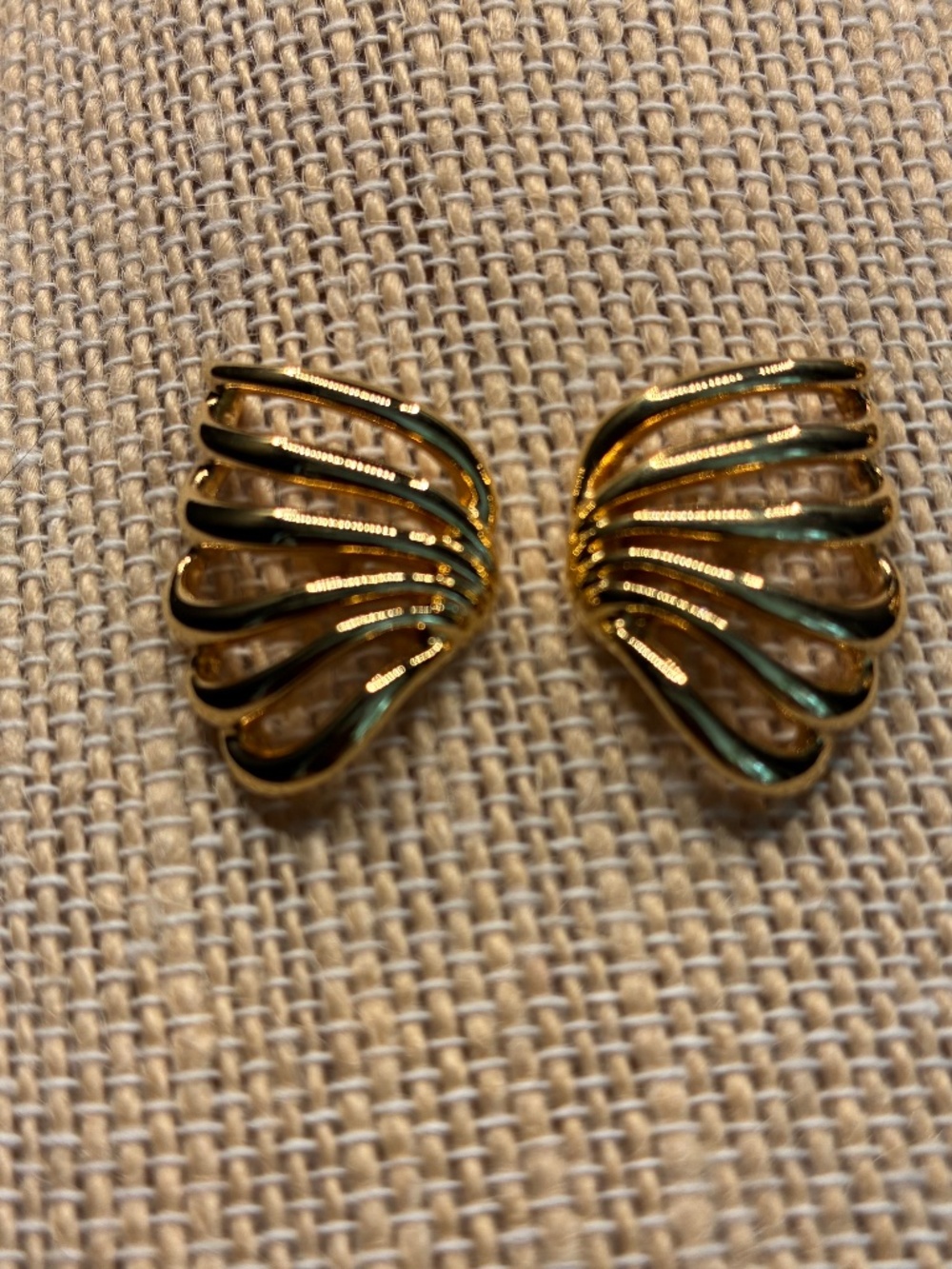 Vintage Monet gold-tone 14K post back earrings with wavy design.